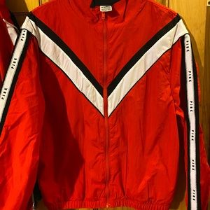 Red windbreaker zip up. Never Worn